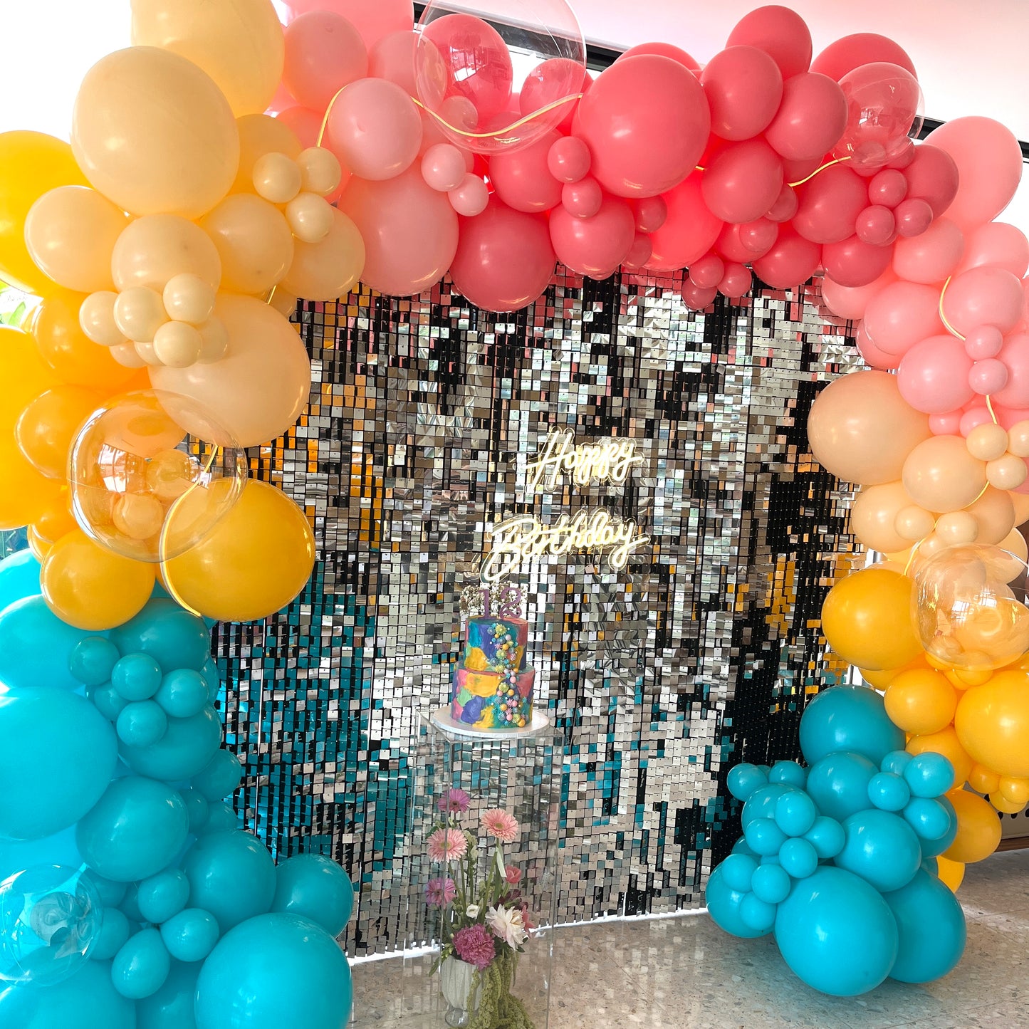 Shimmer disco wall with balloon garland