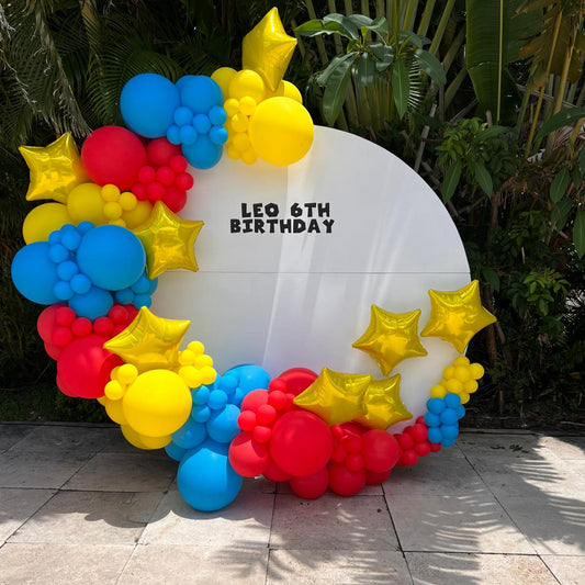 Circle backdrop with balloon garland personalized lettering Rental