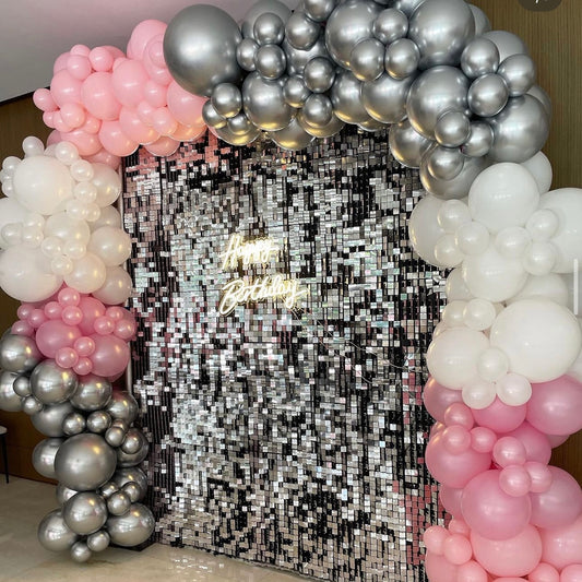 Shimmer disco wall with balloon garland