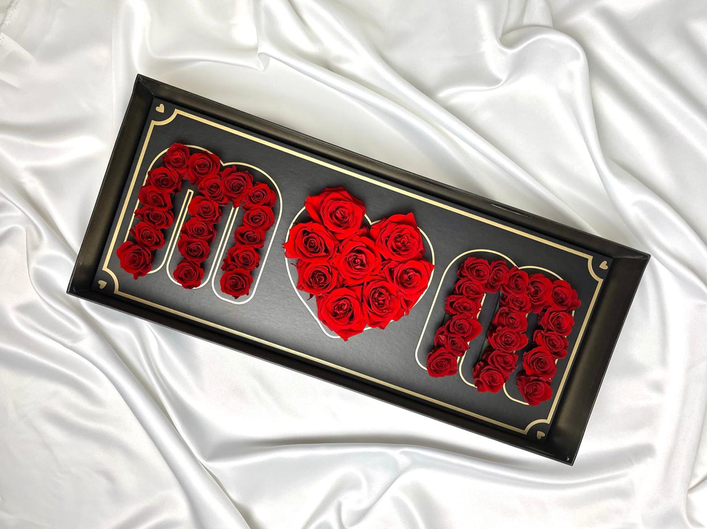 box that says MOM with red roses on it